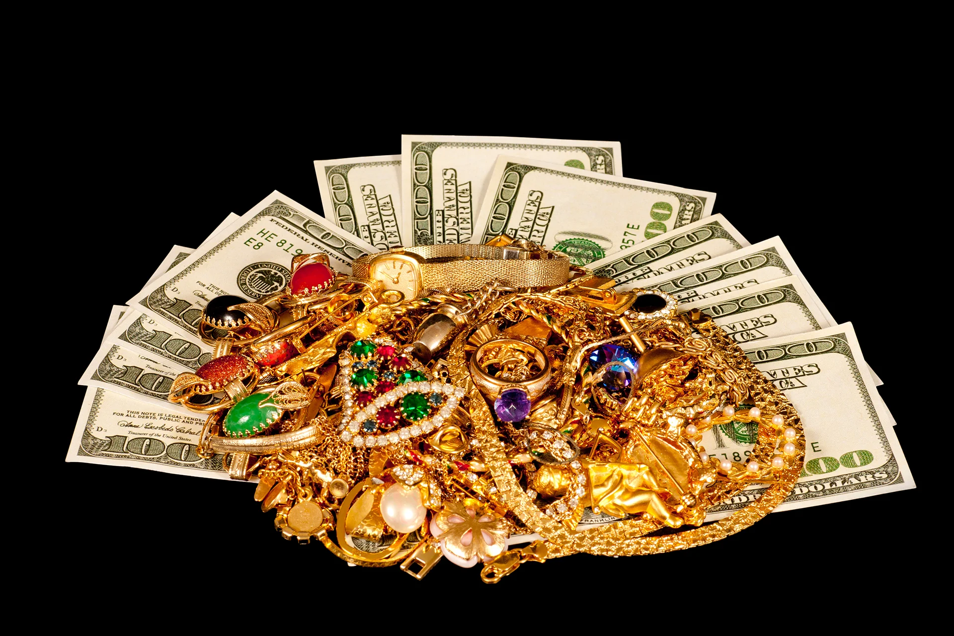Gold jewelry, watches, and valuables on display